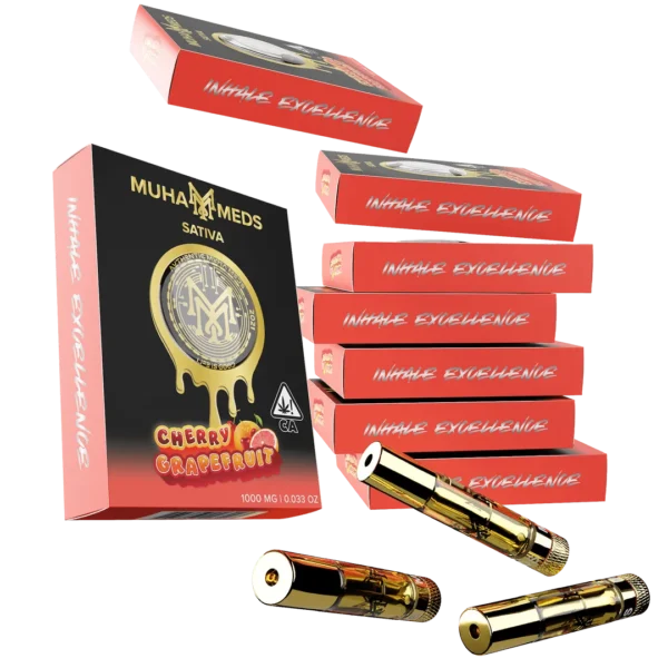 Muha Meds Cherry Grapefruit Sativa 1000MG distillate vape cartridges with gold-finish hardware and black-and-coral Inhale Excellence packaging.