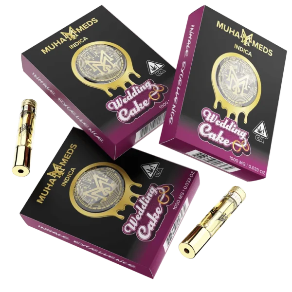Muha Meds Wedding Cake Indica 1000MG vape cartridges with black and magenta branded retail packaging.